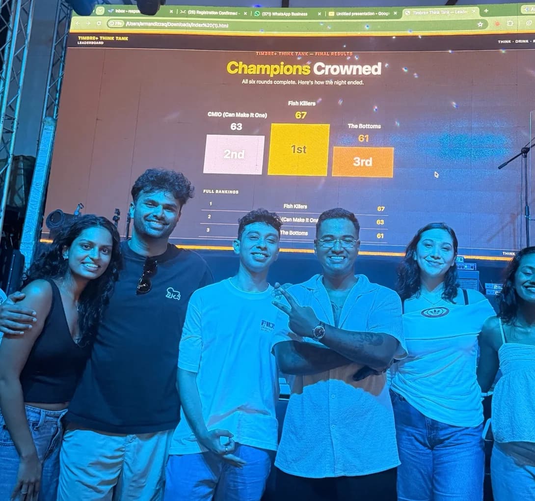 Armand and guests celebrating the end of a live trivia night